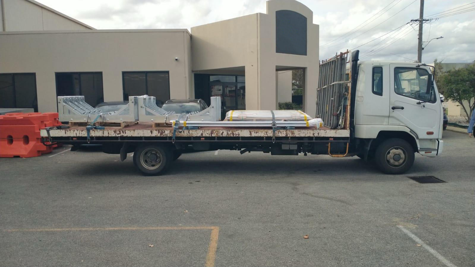ABS Transport company Delivery Truck in front of a building in western Australia