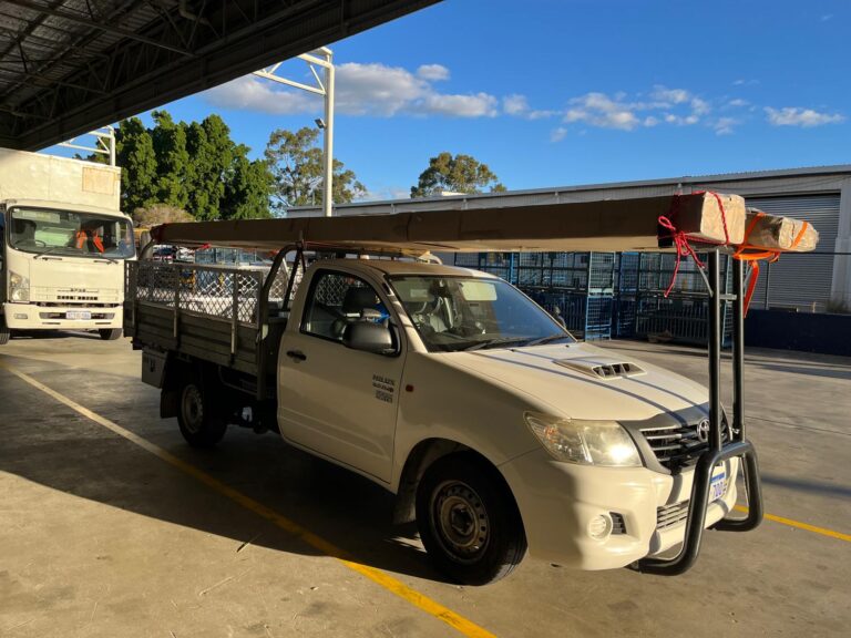 ABS Transport mini delivery truck Toyota Hilux front view with loaded items