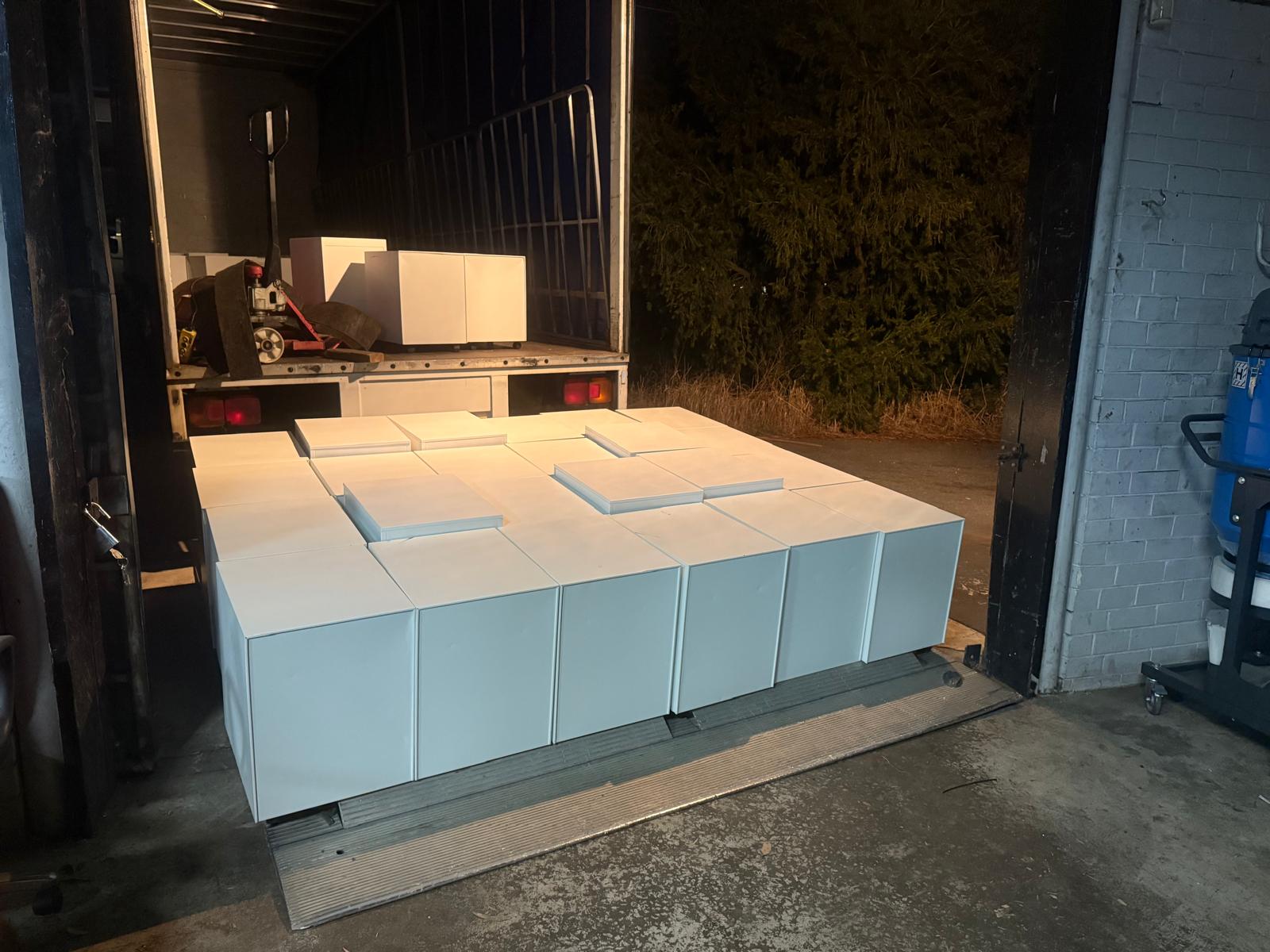 ABS Transport trucking company delivery truck with opened tail lift heavy item loaded