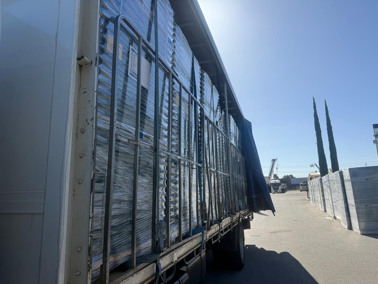 ABS Transport trucking company loaded truck with office or business relocation items including fridges in western australia